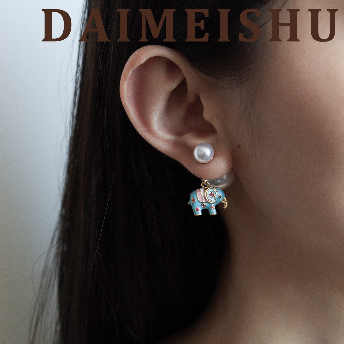 Model wearing Vintage Enamel Lucky Elephant Pearl Drop Earrings