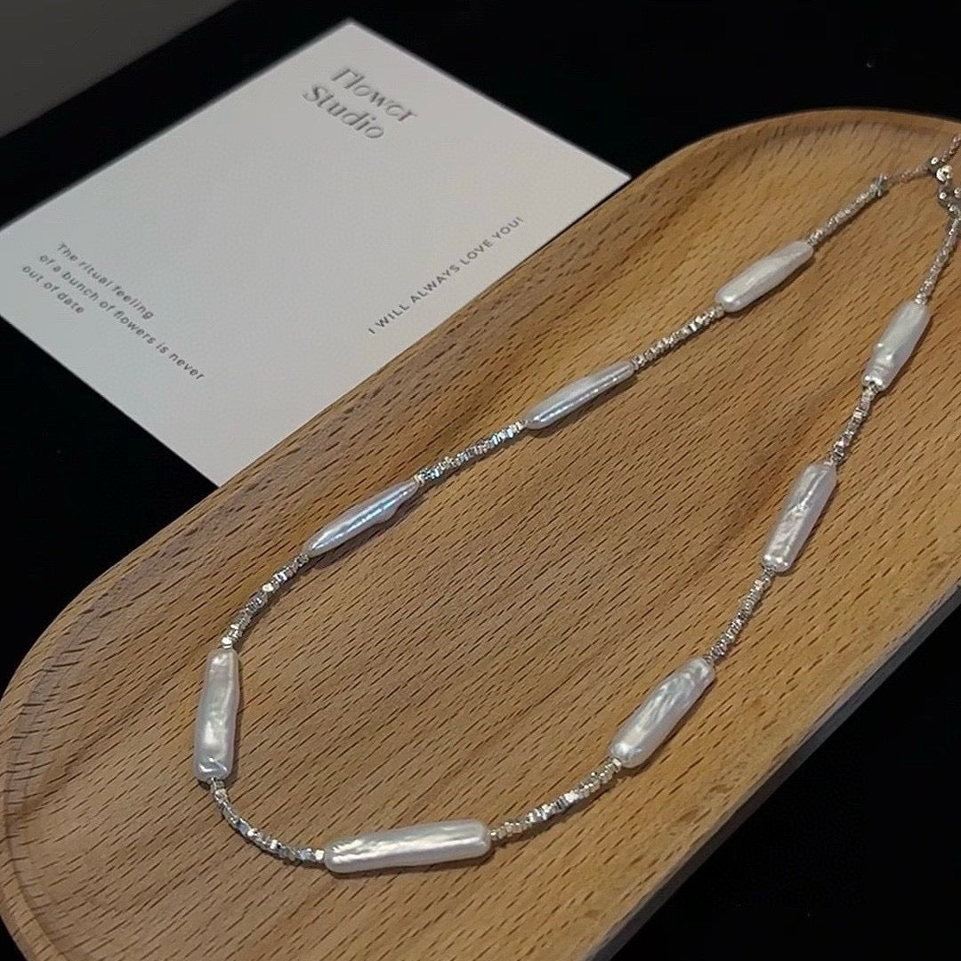 Baroque Stick Pearl and Crushed Silver Necklace on wooden tray