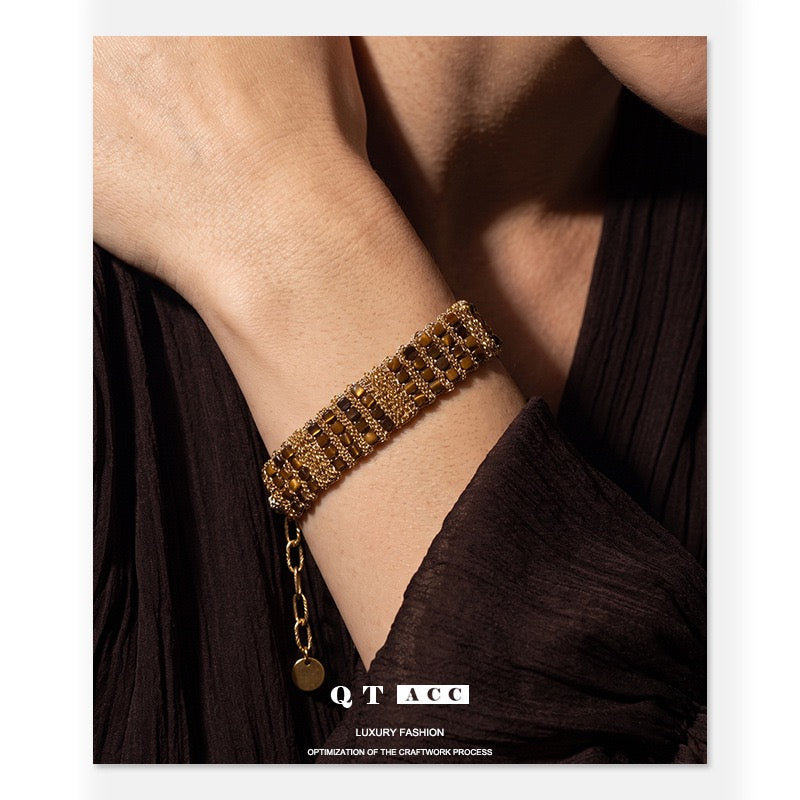 Model wearing French Riviera 18K Gold Beaded Woven Cuff with Tag