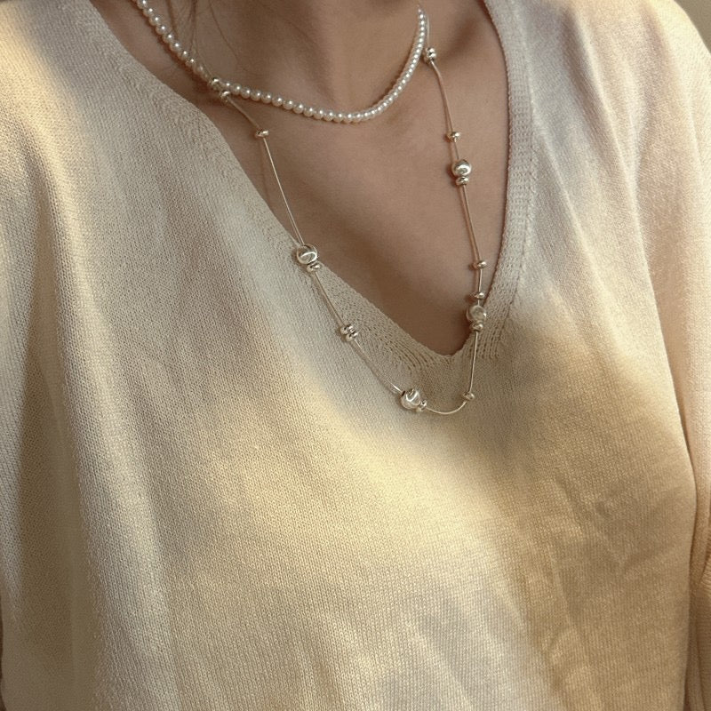 Model wearing S925 Snake Chain as Long Sweater Chain with Spaced Beads