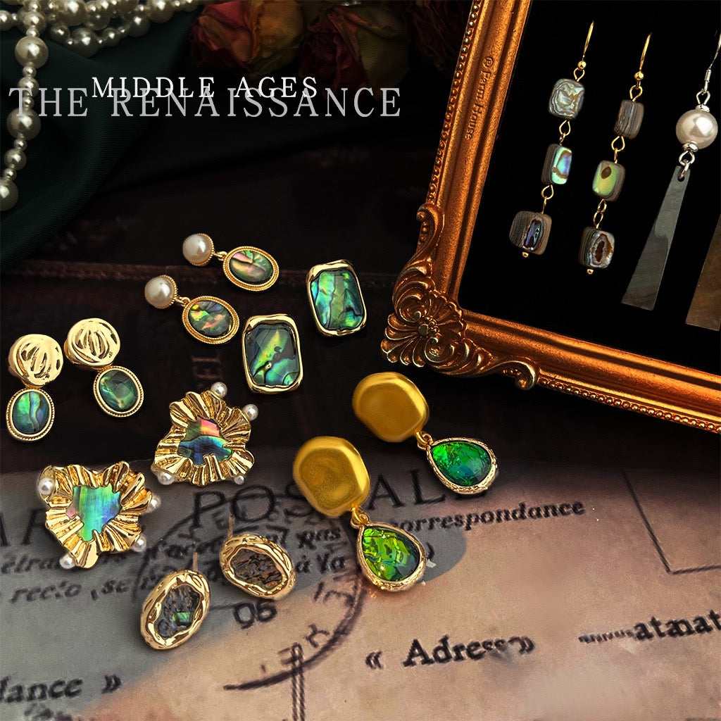 Display of vintage iridescent abalone shell stud and drop earrings