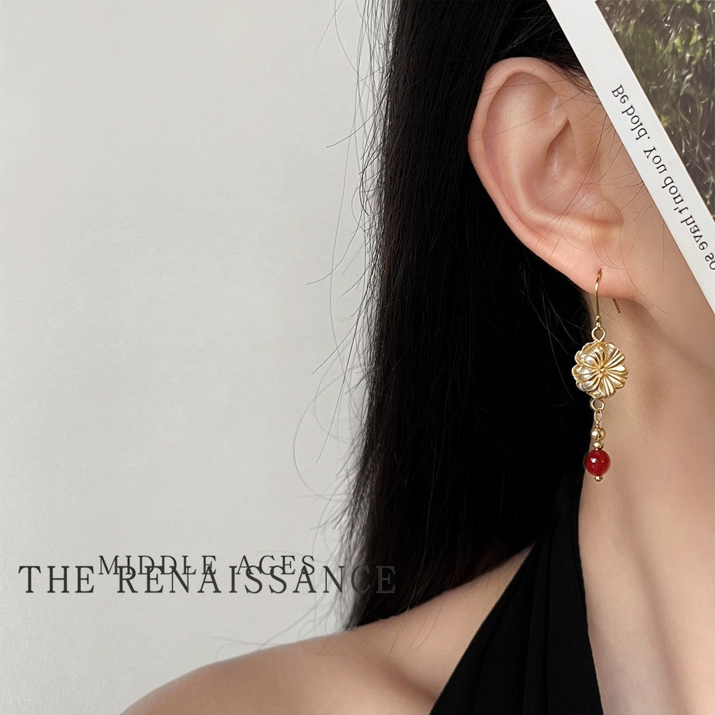 Model wearing champagne Czech glass fluted blossom drop earring