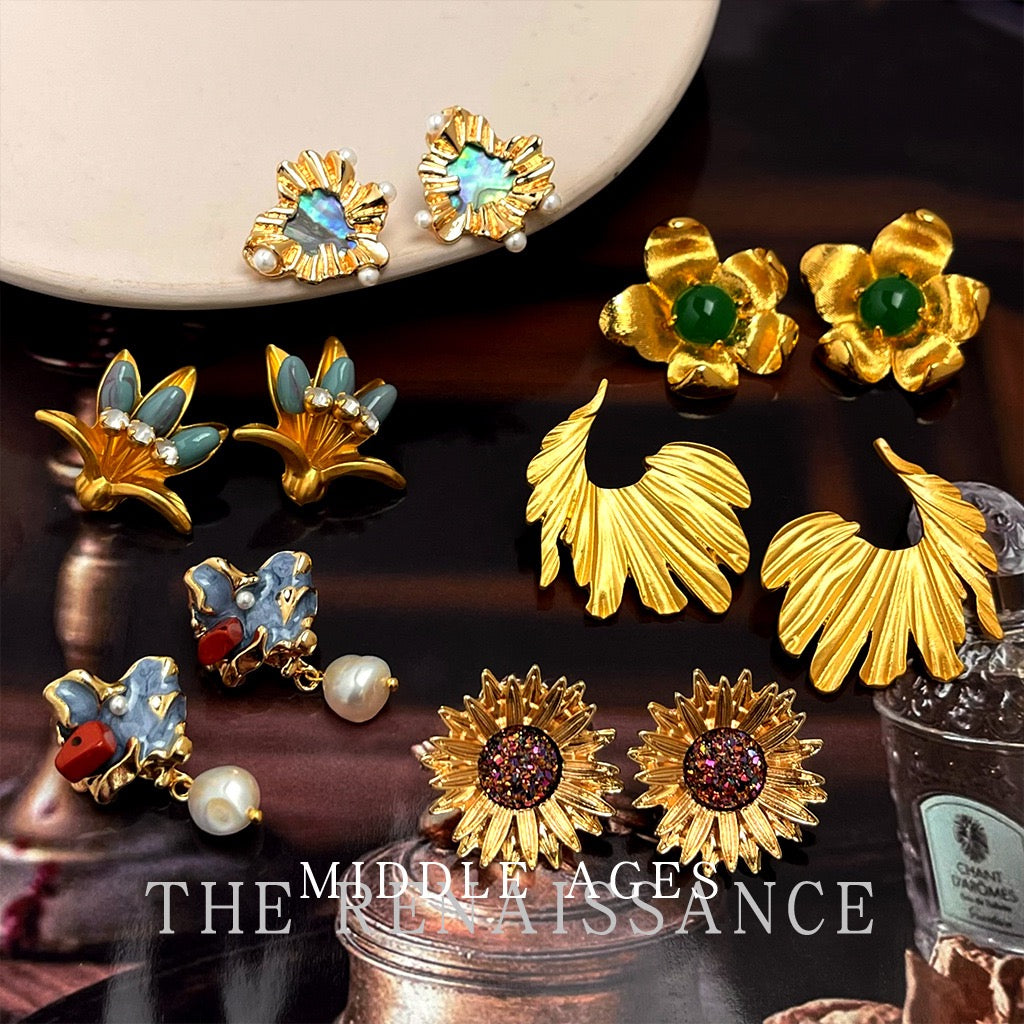 Vintage heavy sculptural botanical gold statement earrings collection display