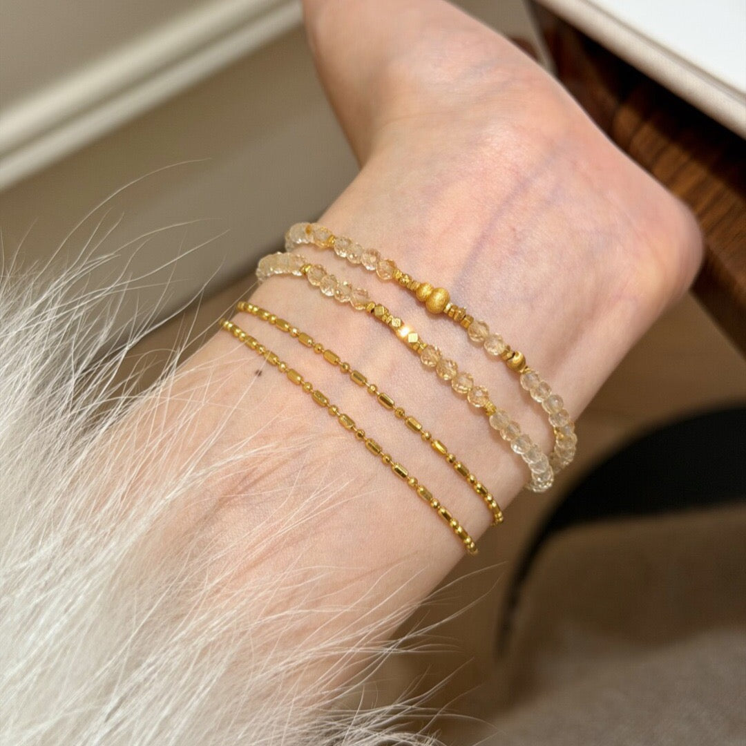 Natural faceted citrine double wrap bracelet with gold gourd charm displayed in a velvet jewelry box