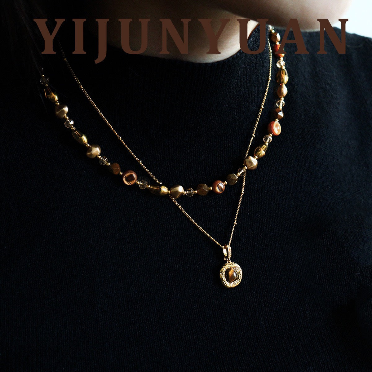 Model wearing French Vintage Tiger Eye Layered Necklace Set on black knitwear