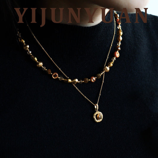 Model wearing French Vintage Tiger Eye Layered Necklace Set on black knitwear