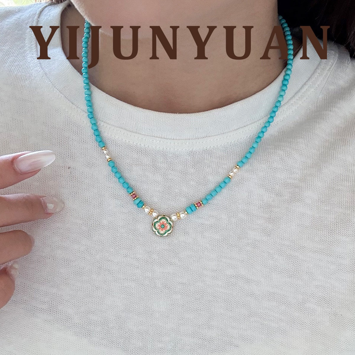 Model wearing Cloisonné Floral Turquoise and Swarovski Pearl Necklace on white top