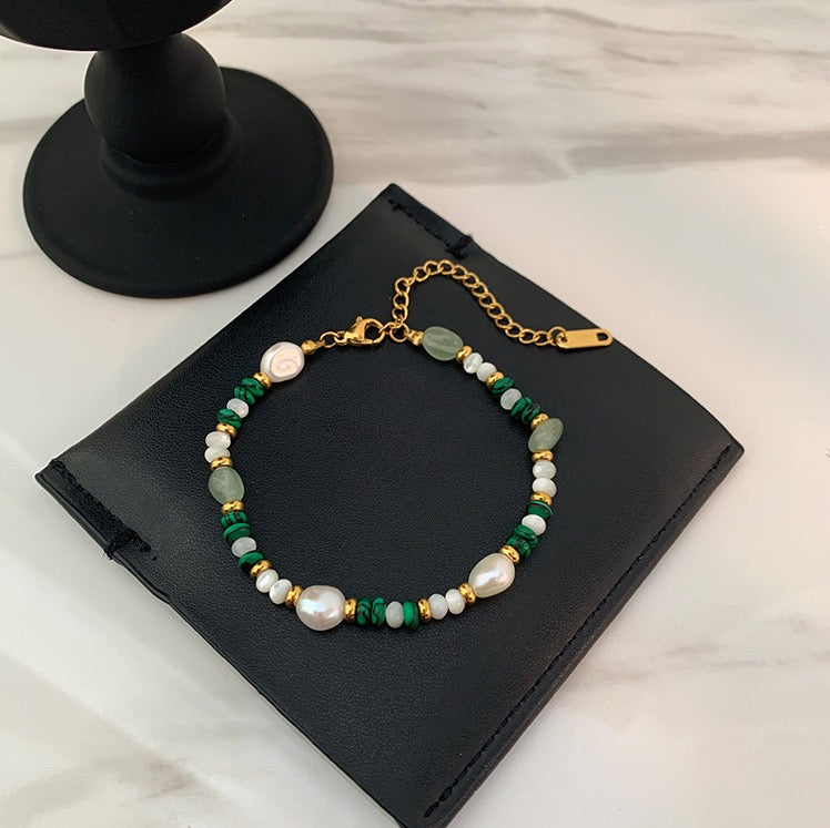 Natural Malachite and Freshwater Pearl Beaded Necklace on Marble