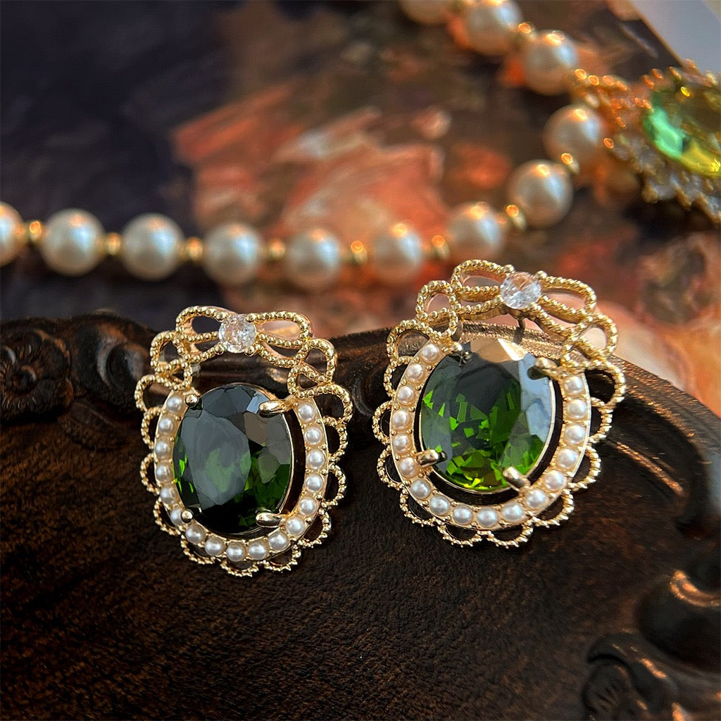 Vintage emerald green oval crystal with seed pearl lace frame stud earrings