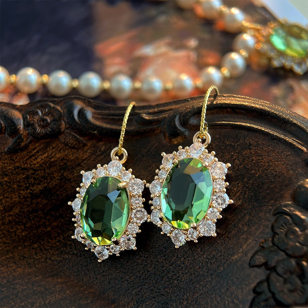 French hook peridot oval gemstone with diamond halo drop earrings