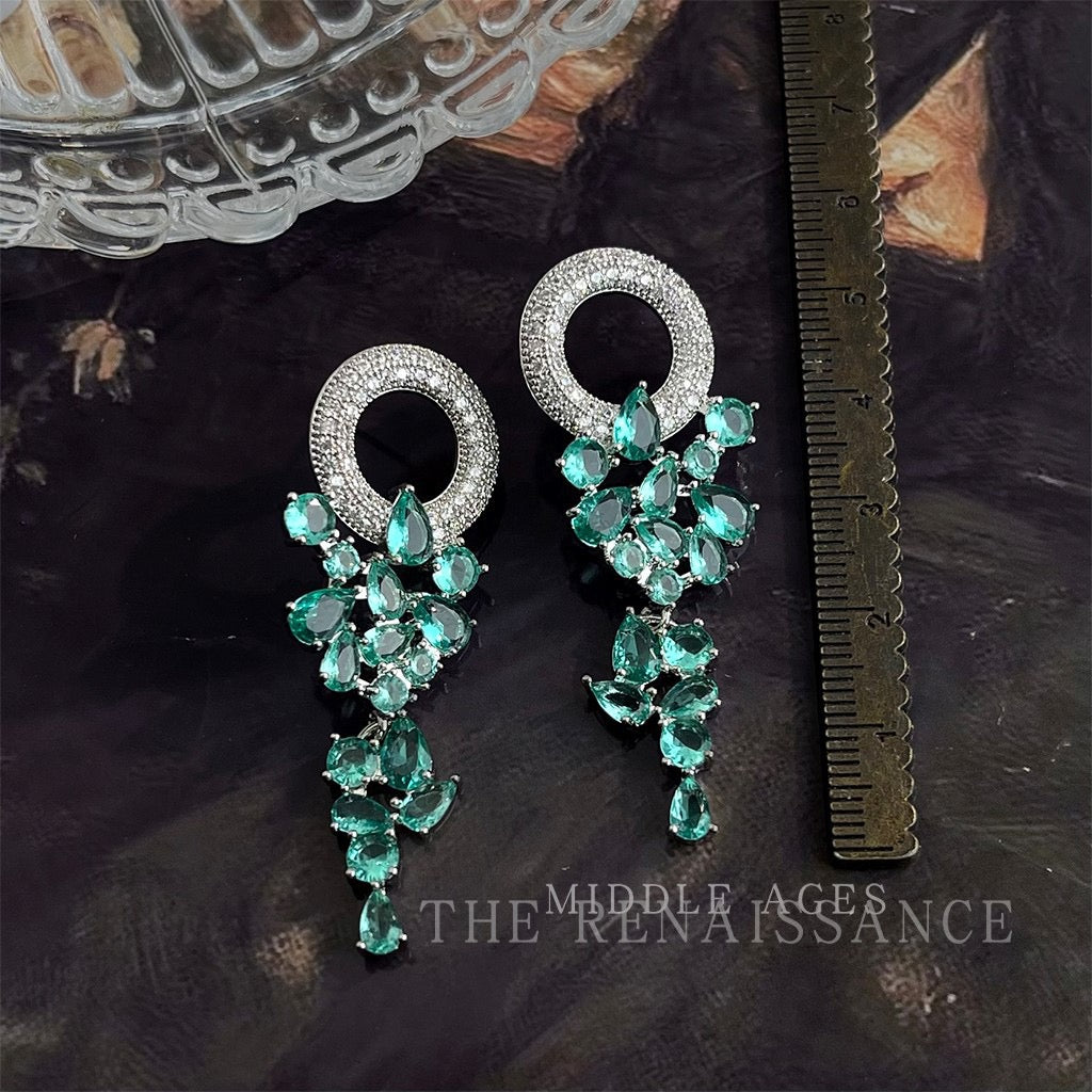 Green crystal tassel chandelier earrings with measurement ruler