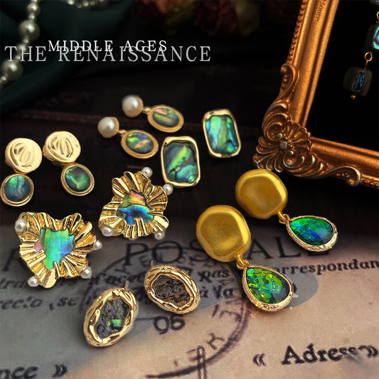Vintage French abalone shell jewelry collection flat lay with antique frame