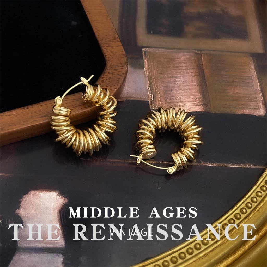Polished ribbed spiral coil torus gold hoop earrings