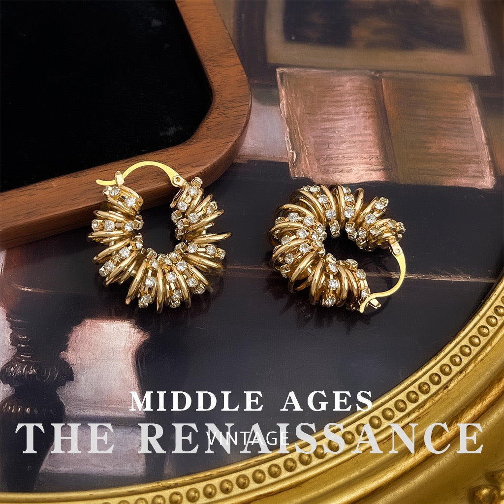 Chunky gold spiral ribbed hoop earrings with pave crystals
