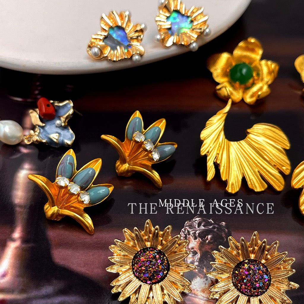 Detailed close up of vintage gold floral and druzy statement studs