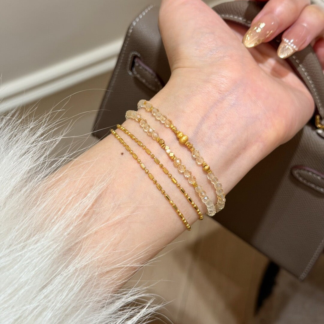 Natural citrine faceted gemstone bracelet styled as a double loop on woman wrist